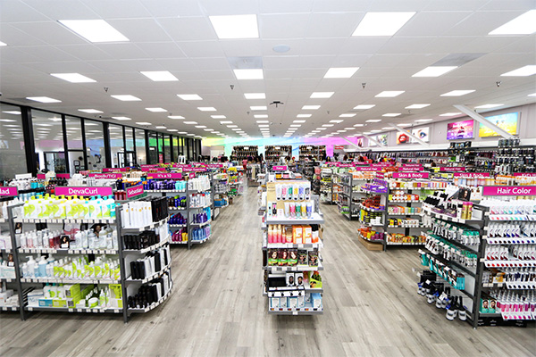 Interior of J Beauty Supply, with wide aisles of hair and beauty products