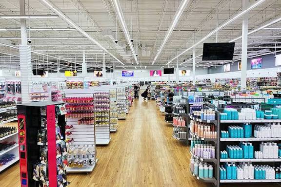 The large beauty supply sales floor seen down the center aisle
